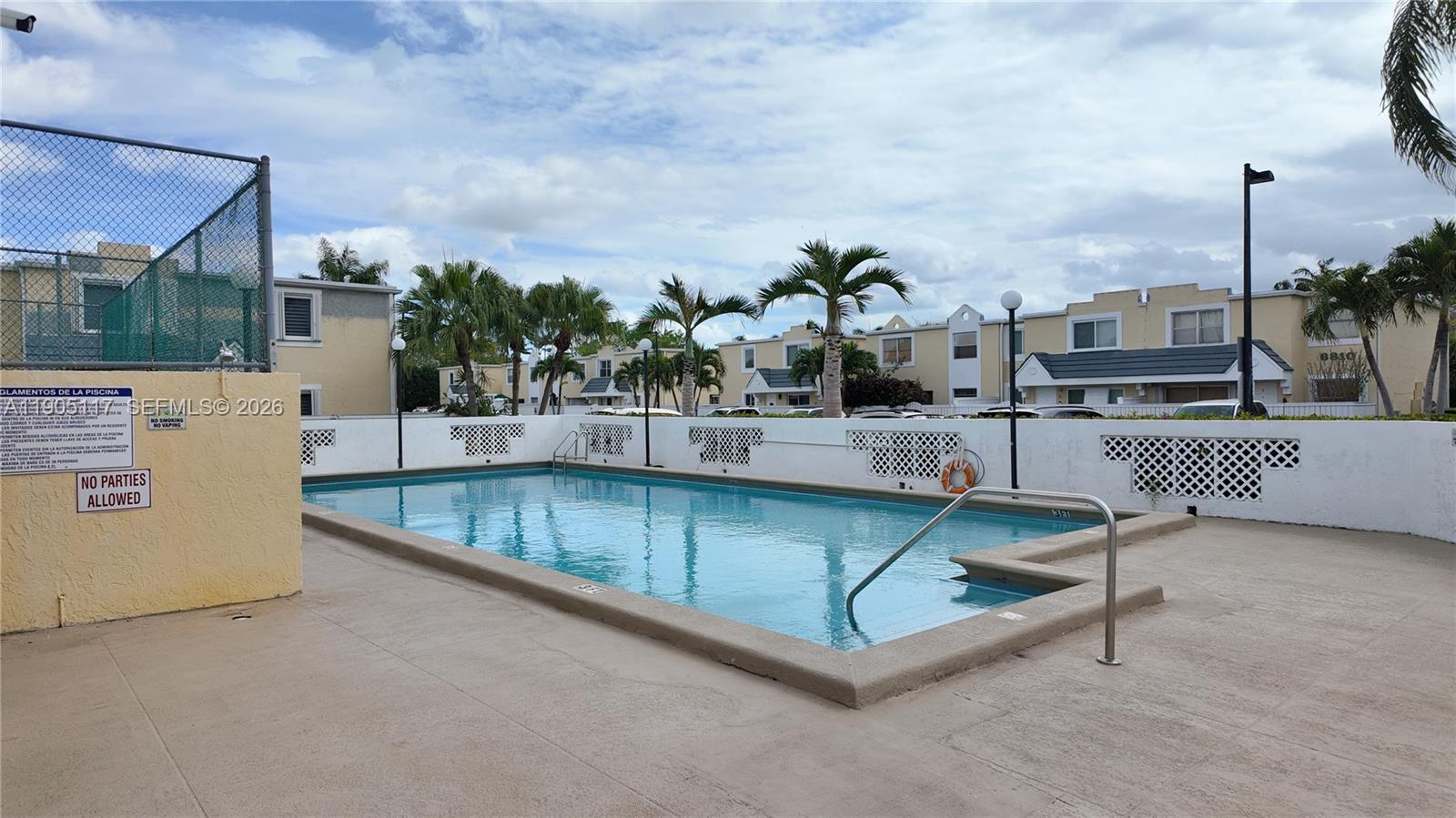 4555 Southwest 68th Ct Circle, Unit 111 Miami, FL 33155 - Photo 33 of 33 a view of a swimming pool with a lounge chairs