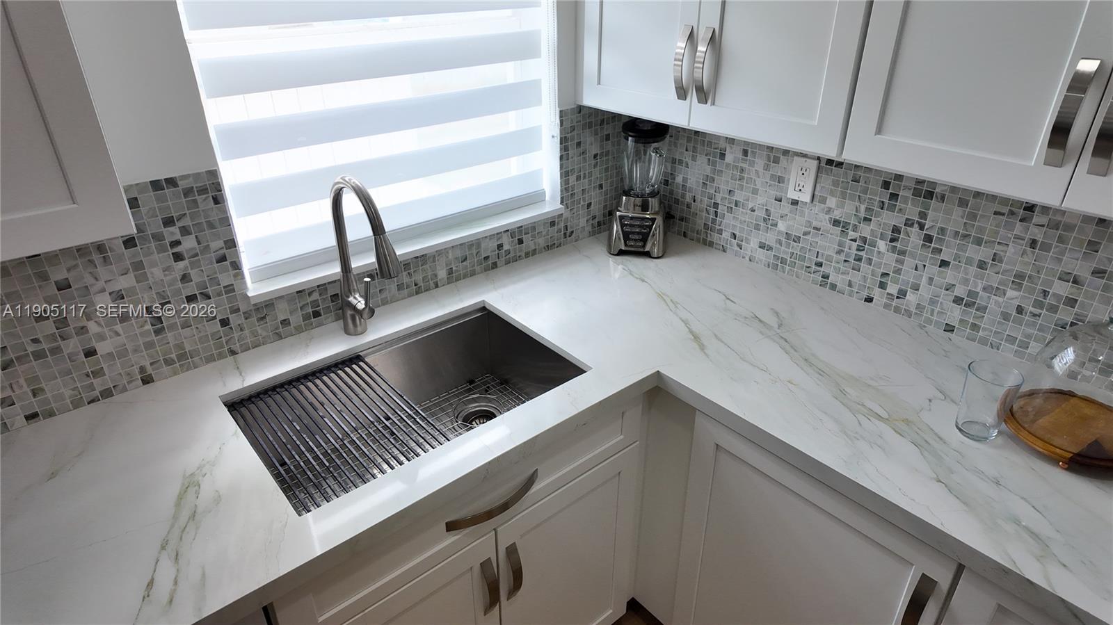 4555 Southwest 68th Ct Circle, Unit 111 Miami, FL 33155 - Photo 10 of 33 a kitchen with a stove and a sink