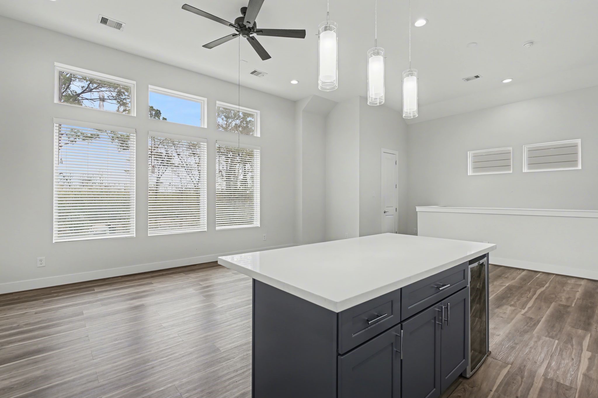 2502 West Tidwell Road, Unit D Houston, TX 77091 - Photo 14 of 24 a kitchen with a wooden floor and window