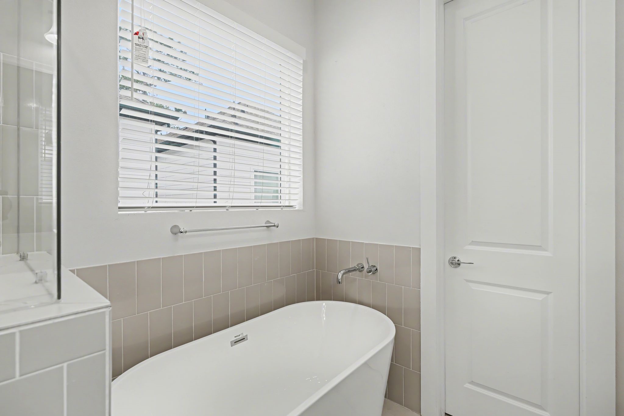 2502 West Tidwell Road, Unit D Houston, TX 77091 - Photo 19 of 24 a white bath tub sitting next to a white sink