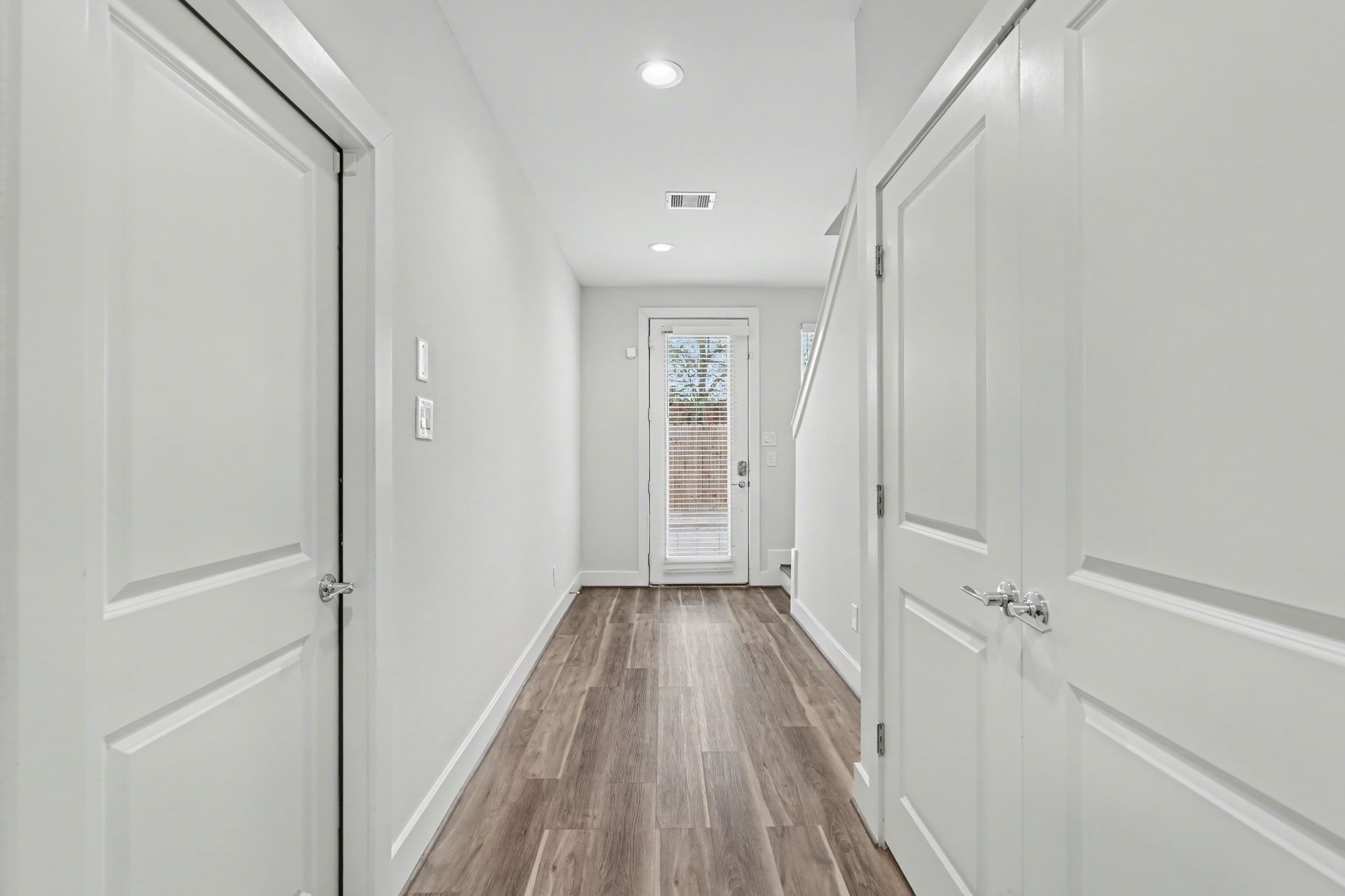 2502 West Tidwell Road, Unit D Houston, TX 77091 - Photo 2 of 24 a view of a hallway with wooden floor and a hallway