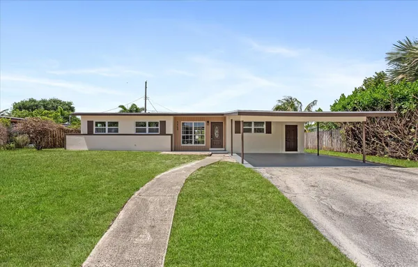 front view of a house with a yard