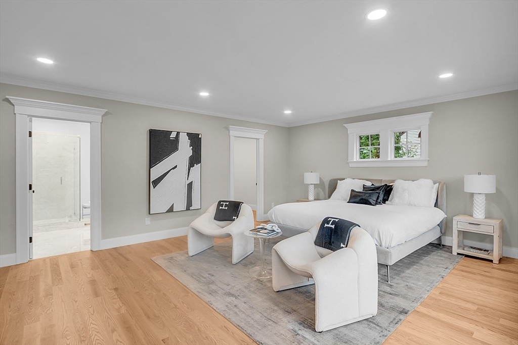105 Elmwood Road Wellesley, MA 02481 - Photo 20 of 30 a spacious bedroom with a bed and a couch