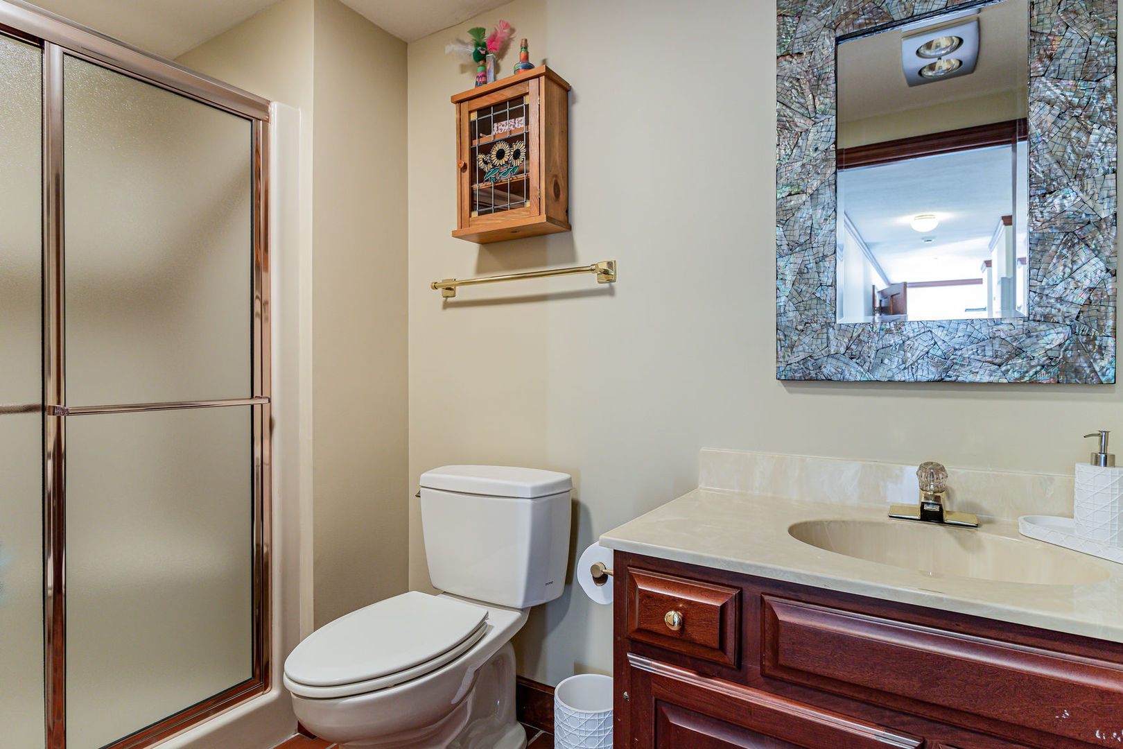 1105 Galen Drive Champaign, IL 61821 - Photo 2 of 2 a white toilet sitting next to a bathroom sink