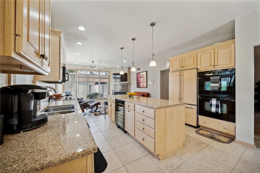 339 Kathy Drive Belle Vernon, PA 15012 - Photo 13 of 48 a large kitchen with stainless steel appliances granite countertop a stove and a refrigerator