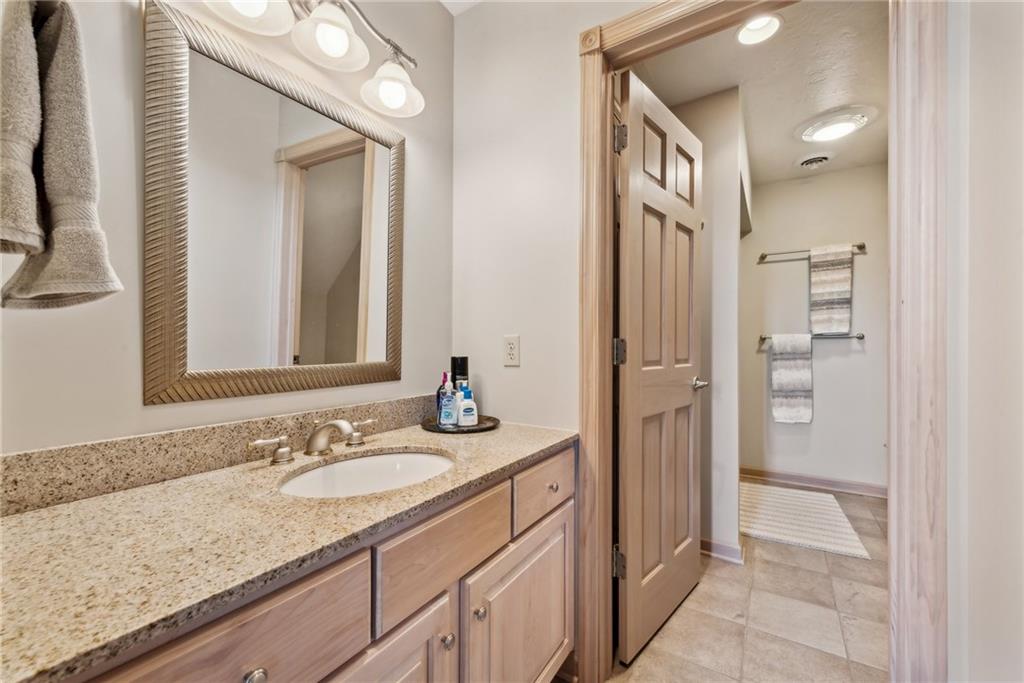 339 Kathy Drive Belle Vernon, PA 15012 - Photo 30 of 48 a bathroom with a granite countertop sink and a mirror
