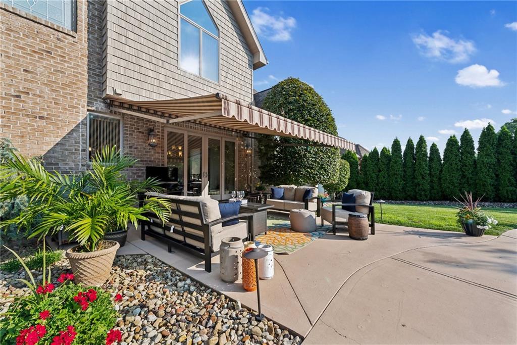 339 Kathy Drive Belle Vernon, PA 15012 - Photo 38 of 48 a view of a patio with couches table and chairs and potted plants