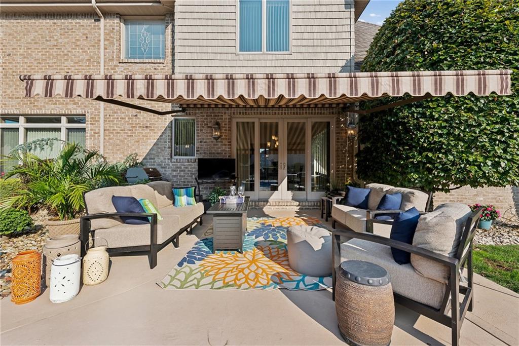 339 Kathy Drive Belle Vernon, PA 15012 - Photo 39 of 48 a view of a patio with table and chairs potted plants and a house