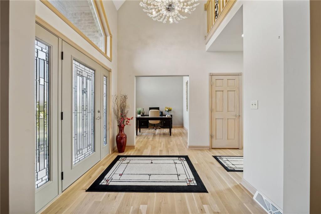 339 Kathy Drive Belle Vernon, PA 15012 - Photo 5 of 48 a view of a hallway with wooden floor and staircase
