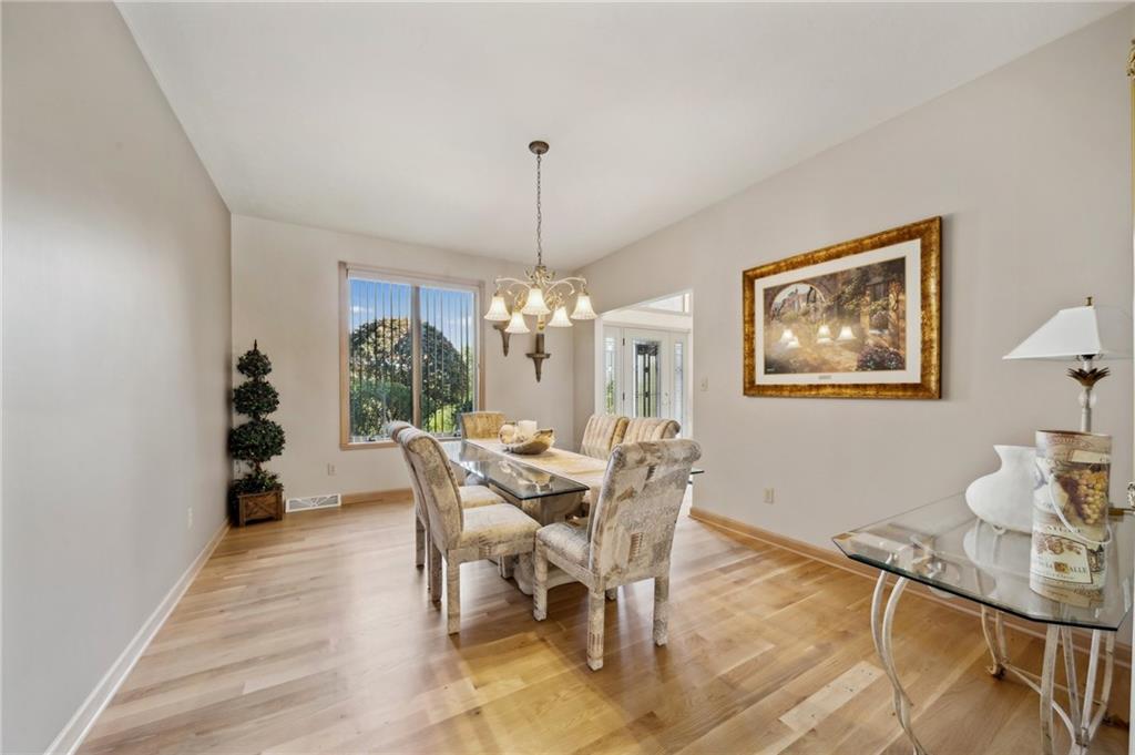 339 Kathy Drive Belle Vernon, PA 15012 - Photo 7 of 48 a dining room with furniture a chandelier and wooden floor