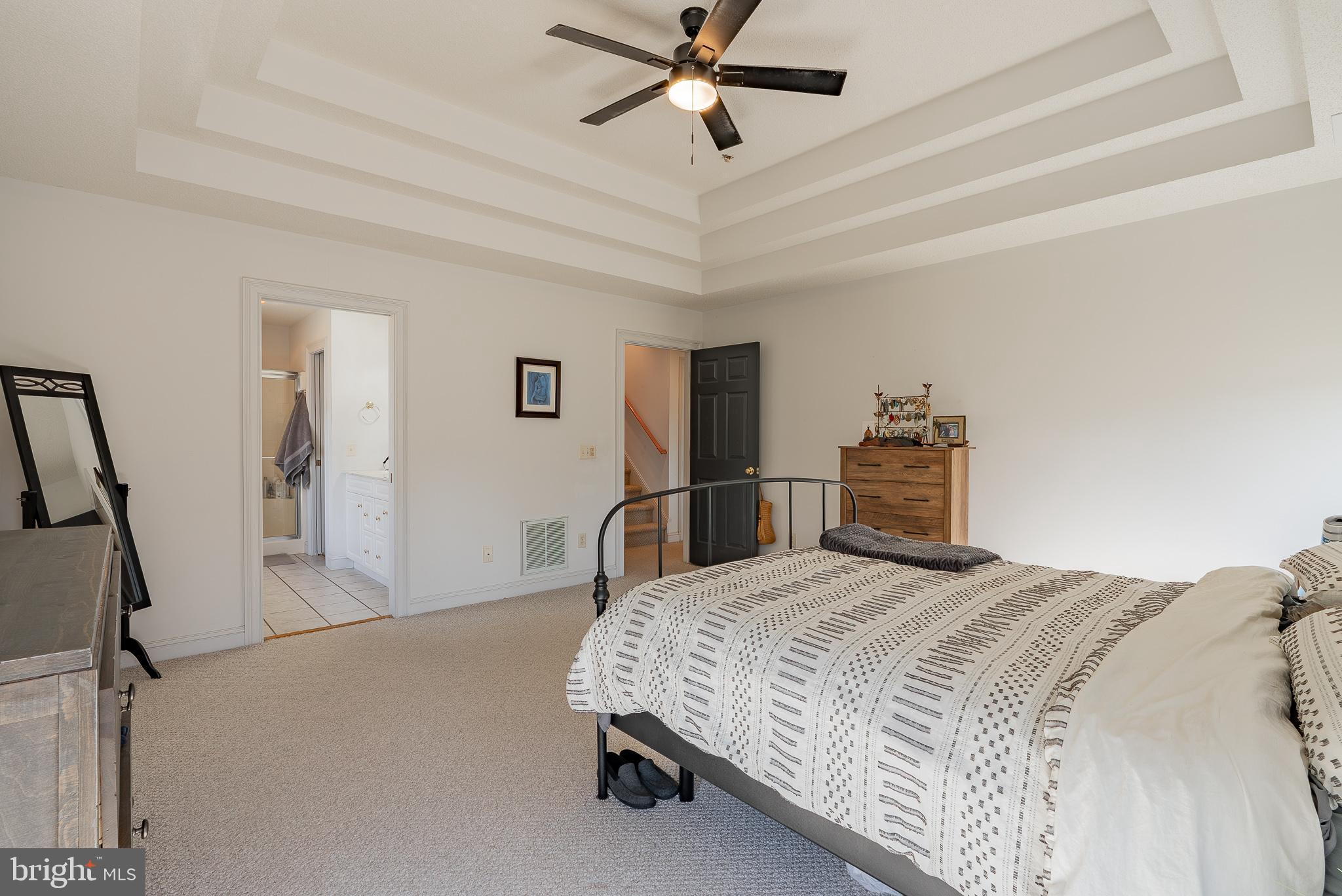 3741 Davis Road Penn Laird, VA 22846 - Photo 30 of 93 a bedroom with a bed and a chandelier