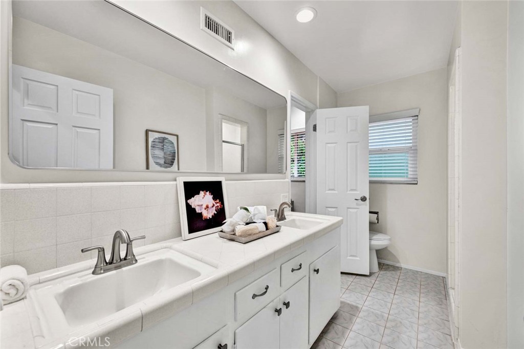 5411 Cadbury Road Whittier, CA 90601 - Photo 18 of 50 Primary bathroom with dual sink vanity