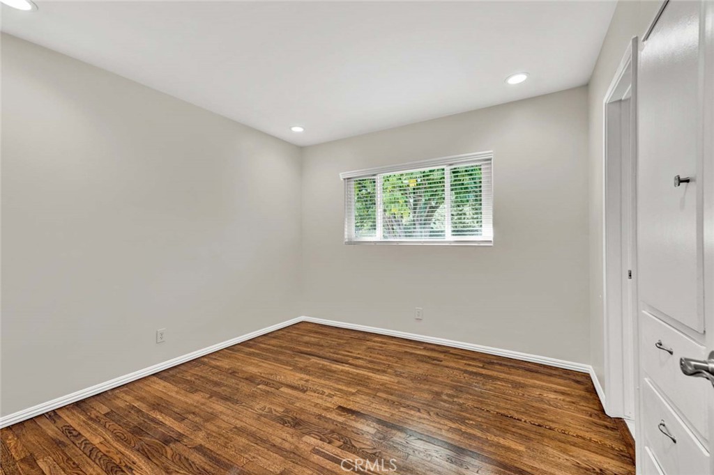 5411 Cadbury Road Whittier, CA 90601 - Photo 21 of 50 Bedroom with wood flooring and built-in closet with access to jack and jill bathroom
