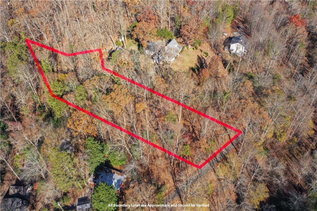 3442 Jet-Wright Road Gainesville, GA 30506 - Photo 9 of 15 a view of a yard with an umbrella and wooden fence