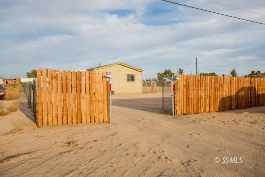 1140 North Calvert Boulevard Ridgecrest, CA 93555 - Photo 2 of 27 a view of a backyard