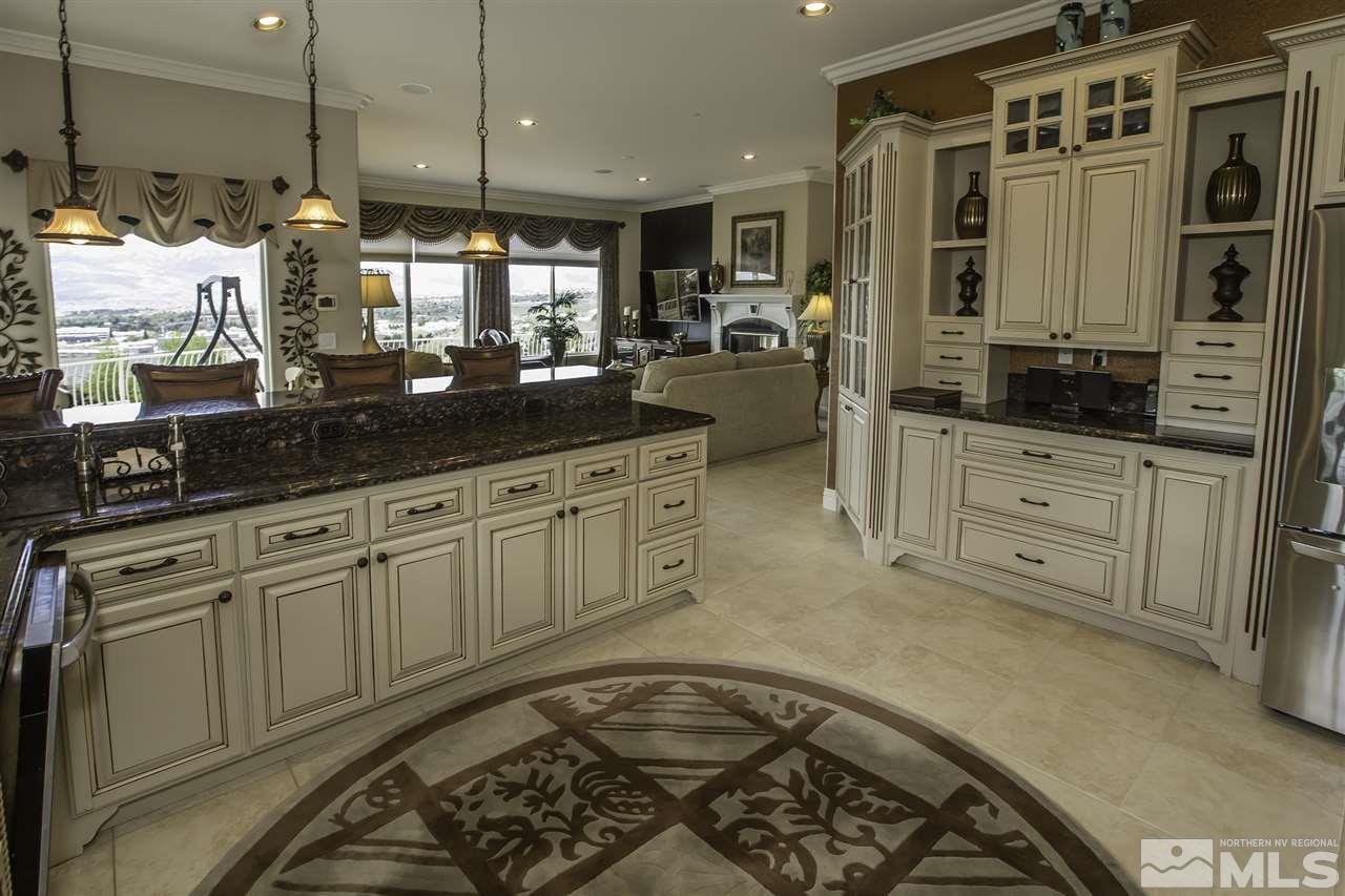 950 Stadium View Court Reno, NV 89512 - Photo 5 of 25 a large kitchen with stainless steel appliances granite countertop a stove a sink and a granite counter tops