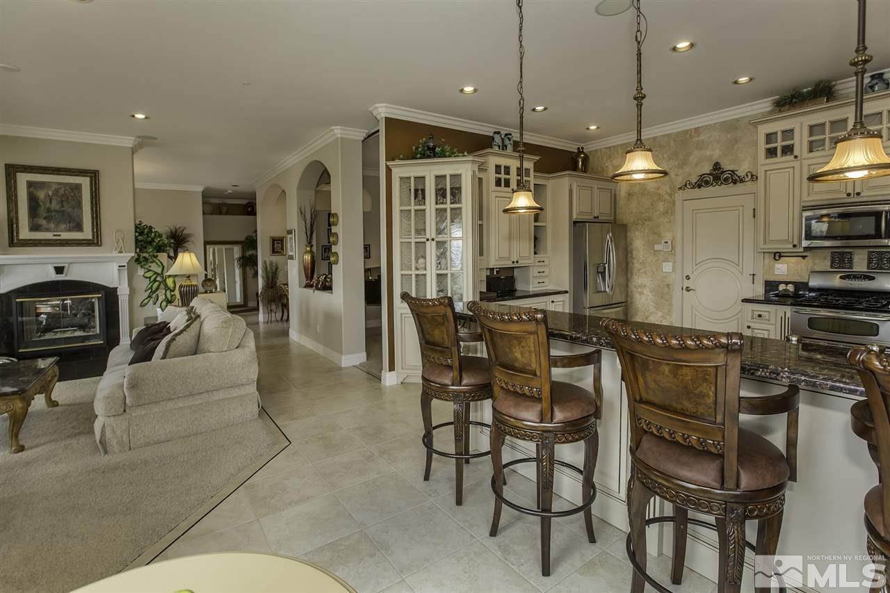 950 Stadium View Court Reno, NV 89512 - Photo 6 of 25 a living room with stainless steel appliances kitchen island granite countertop furniture and a view of kitchen