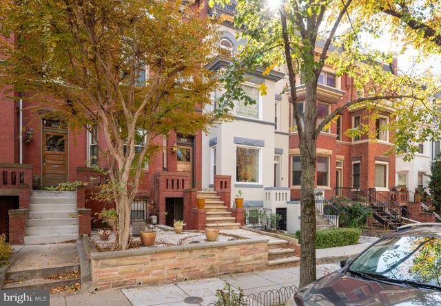 a view of a building with a tree