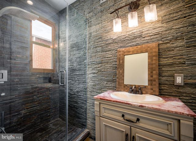 a bathroom with a bathtub and a toilet