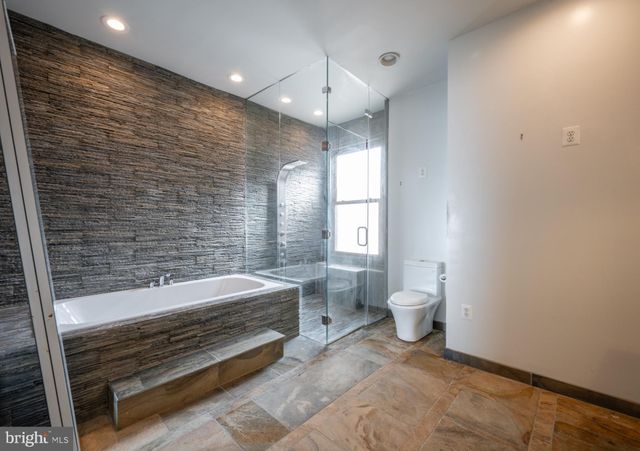 a bathroom with a sink and a washer