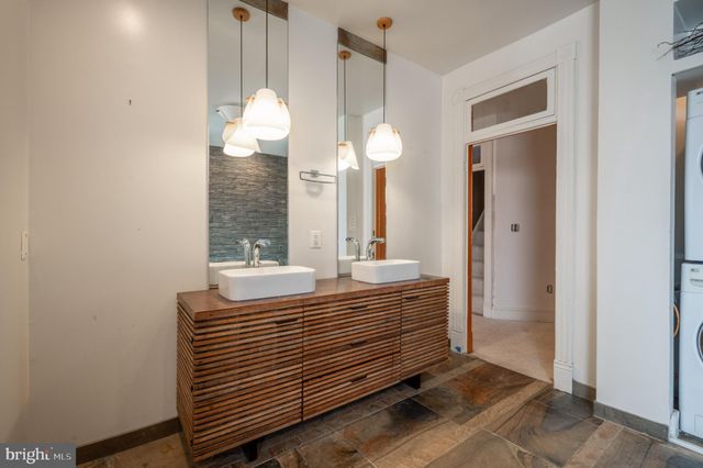 a view of a backyard with wooden fence