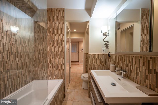 a view of a hallway with washer and dryer