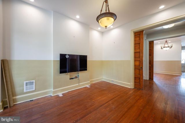 a view of a livingroom with wooden floor