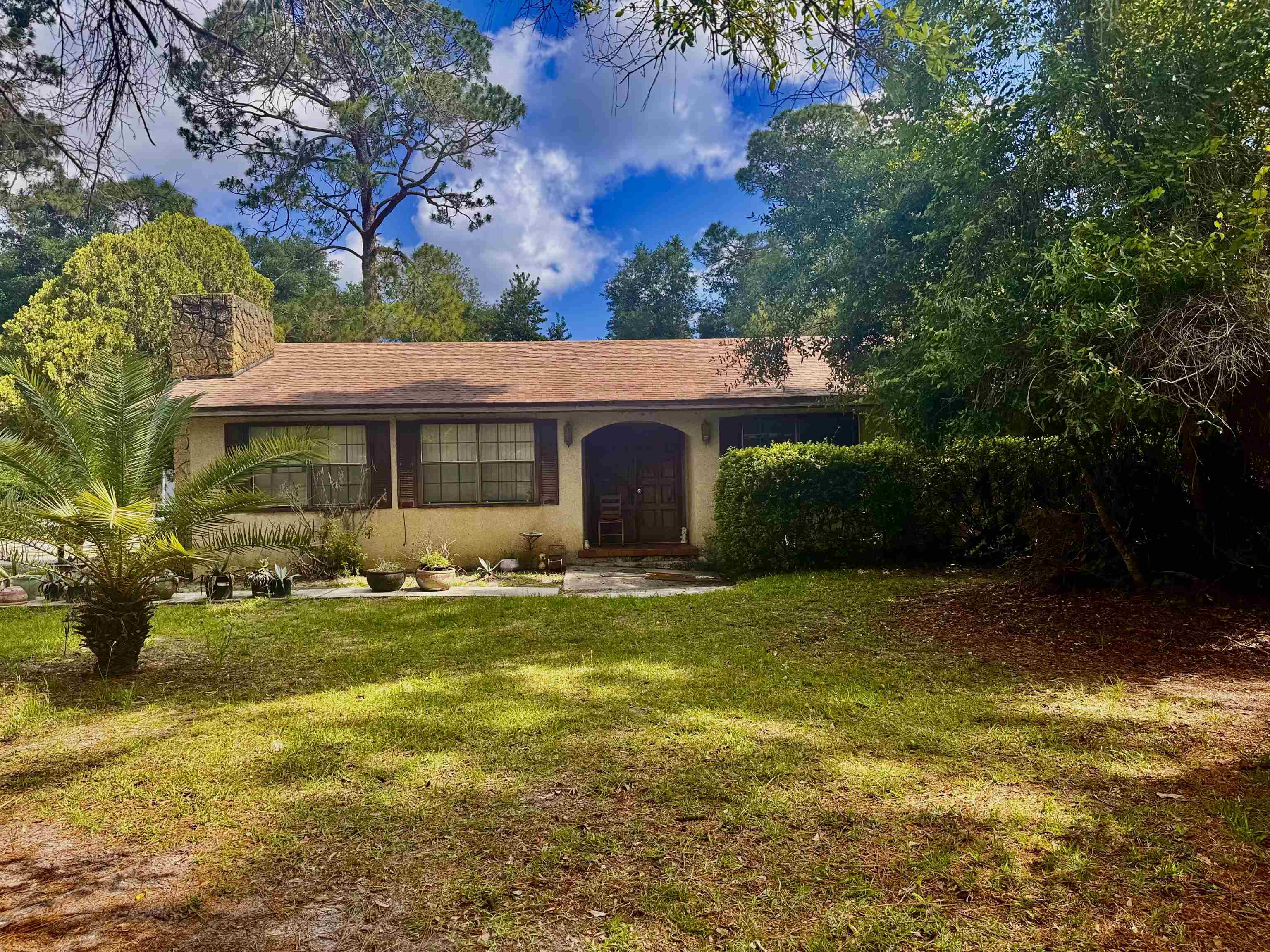 554 Hayley Road St. Augustine, FL 32086 - Photo 1 of 46 a front view of a house with garden