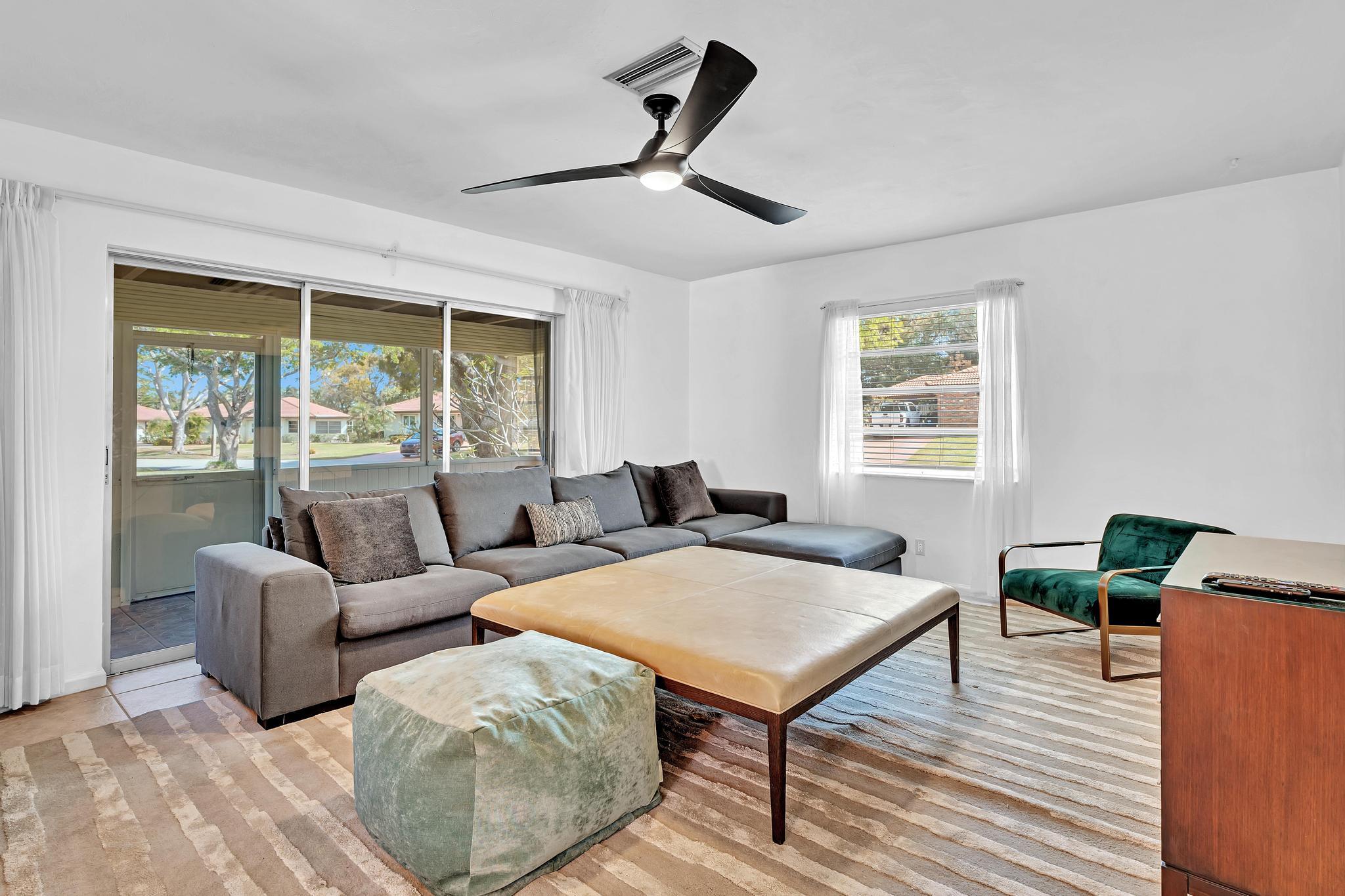 313 Northwest 42nd Street Boca Raton, FL 33431 - Photo 18 of 42 a living room with furniture and a window