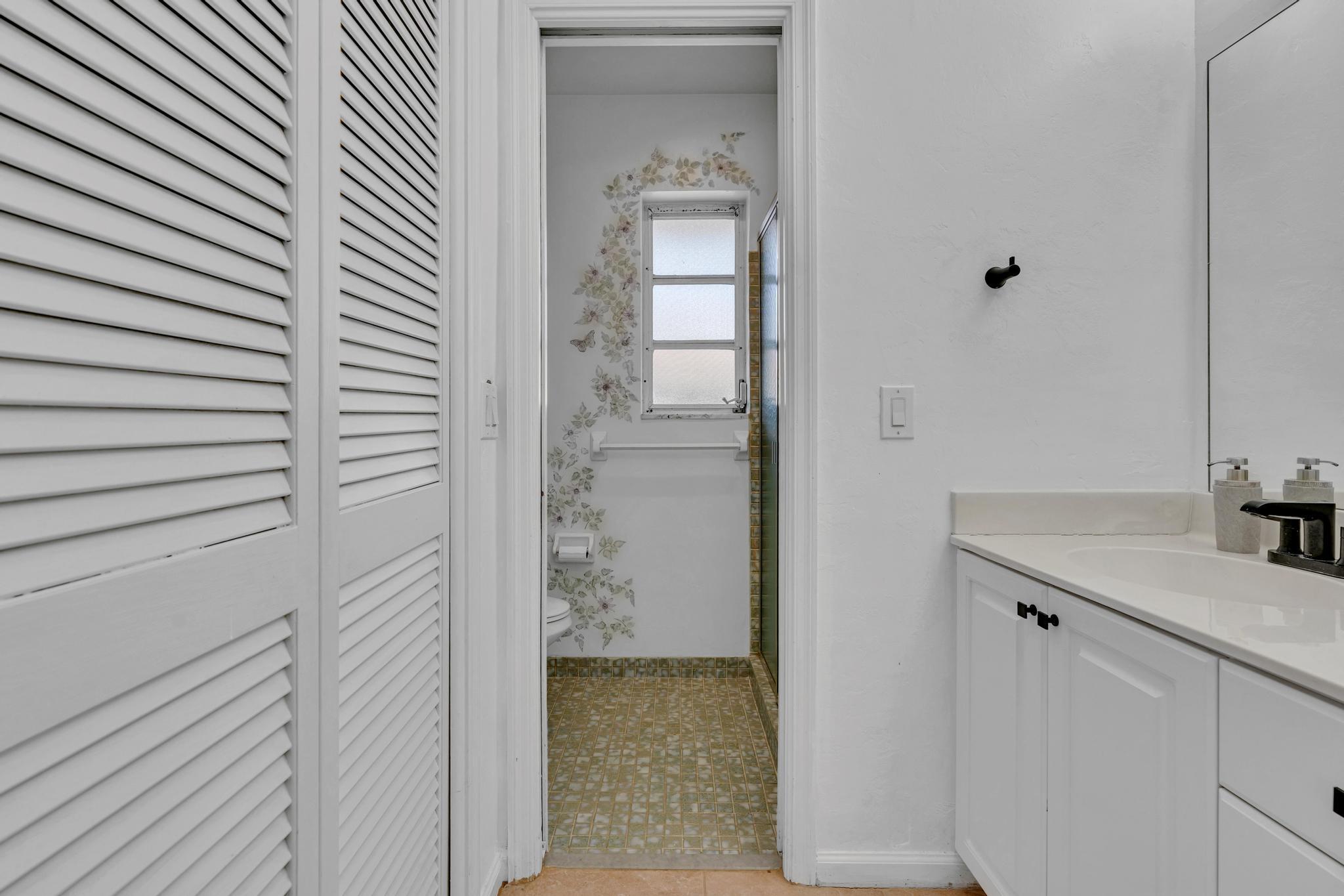 313 Northwest 42nd Street Boca Raton, FL 33431 - Photo 24 of 42 a bathroom with a granite countertop sink and a mirror