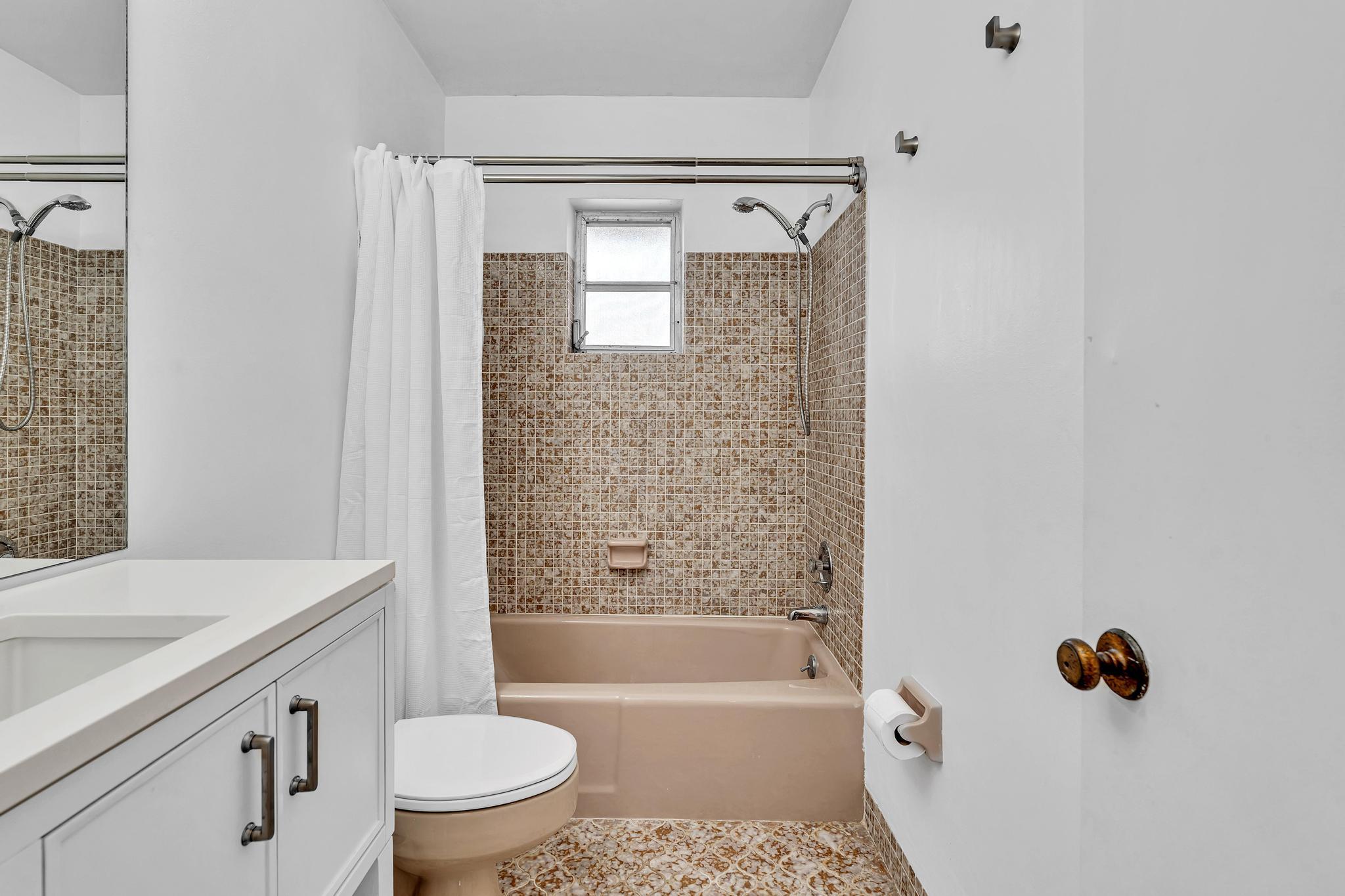 313 Northwest 42nd Street Boca Raton, FL 33431 - Photo 28 of 42 a bathroom with a sink toilet and shower