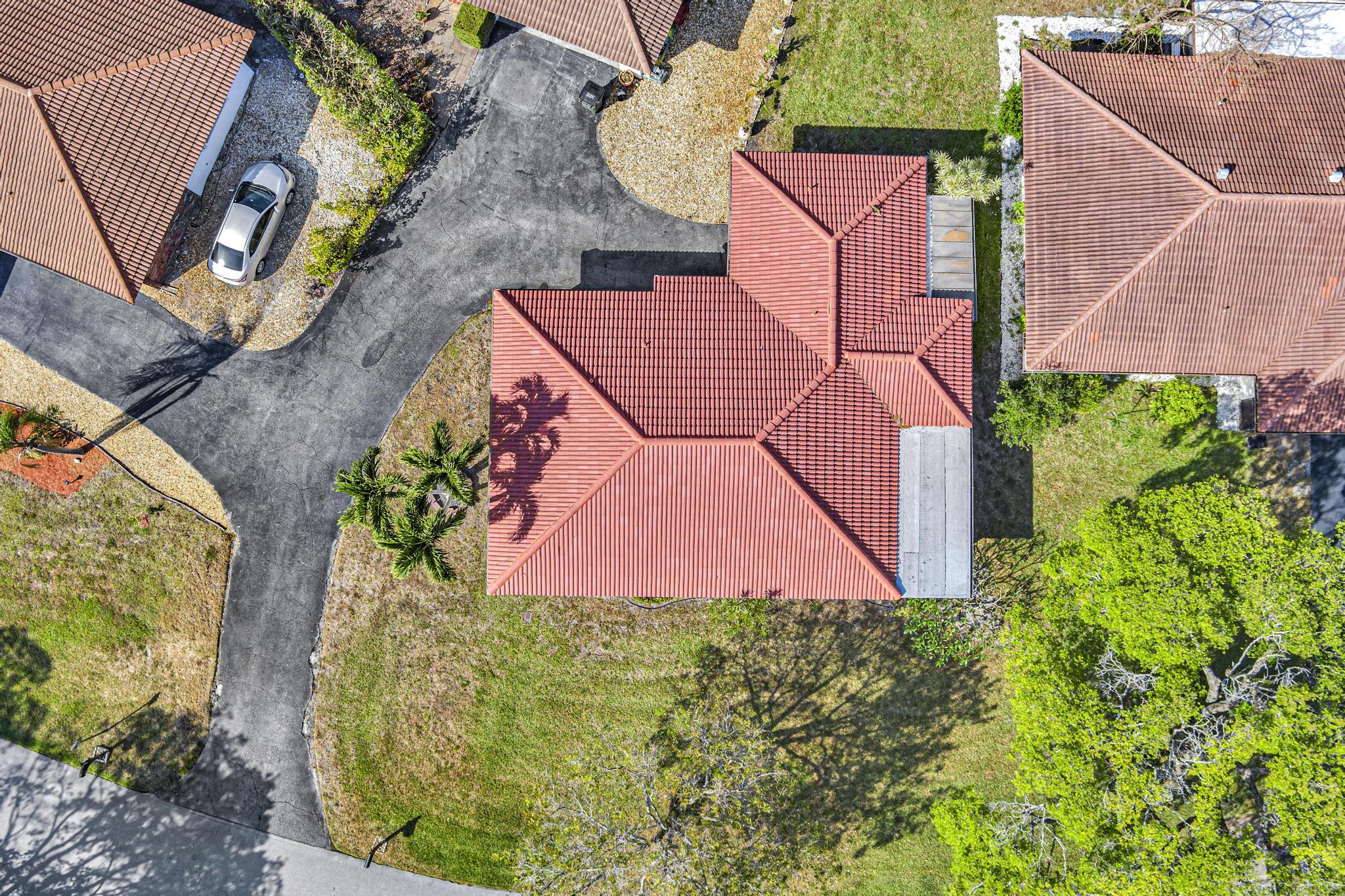 313 Northwest 42nd Street Boca Raton, FL 33431 - Photo 39 of 42 an aerial view of a house with a yard and garden