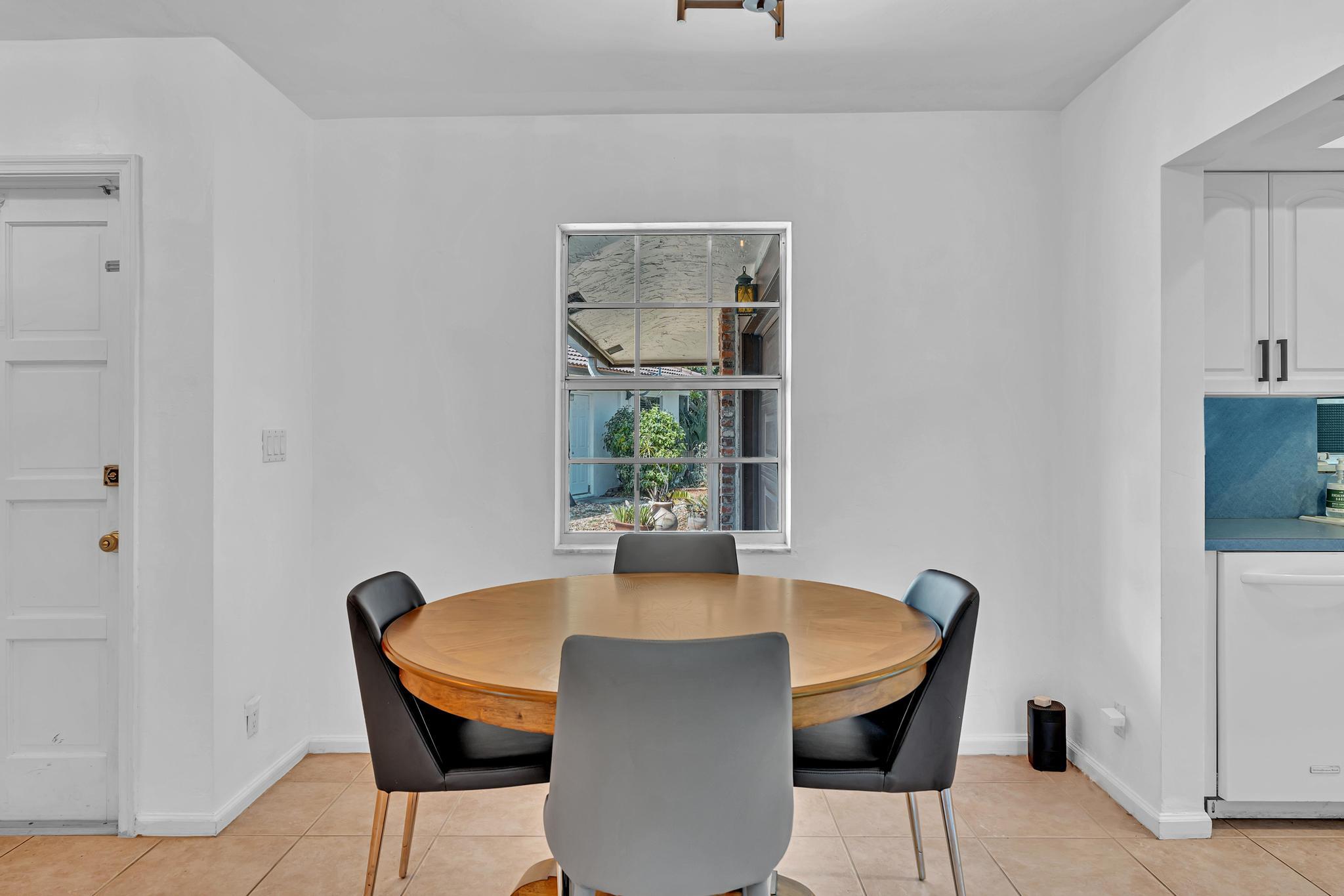 313 Northwest 42nd Street Boca Raton, FL 33431 - Photo 4 of 42 a dining room with furniture and window