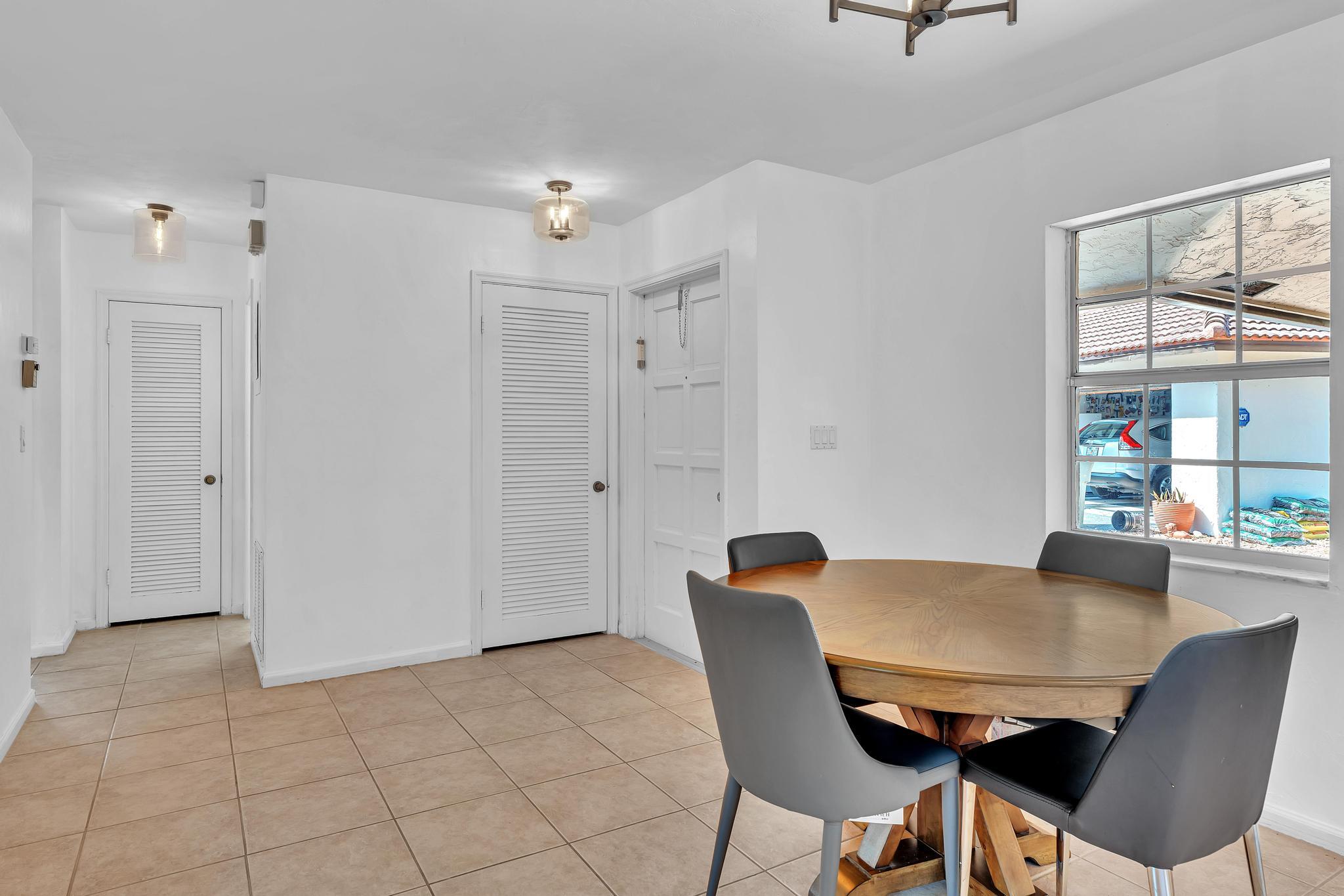 313 Northwest 42nd Street Boca Raton, FL 33431 - Photo 5 of 42 a view of a dining room with furniture