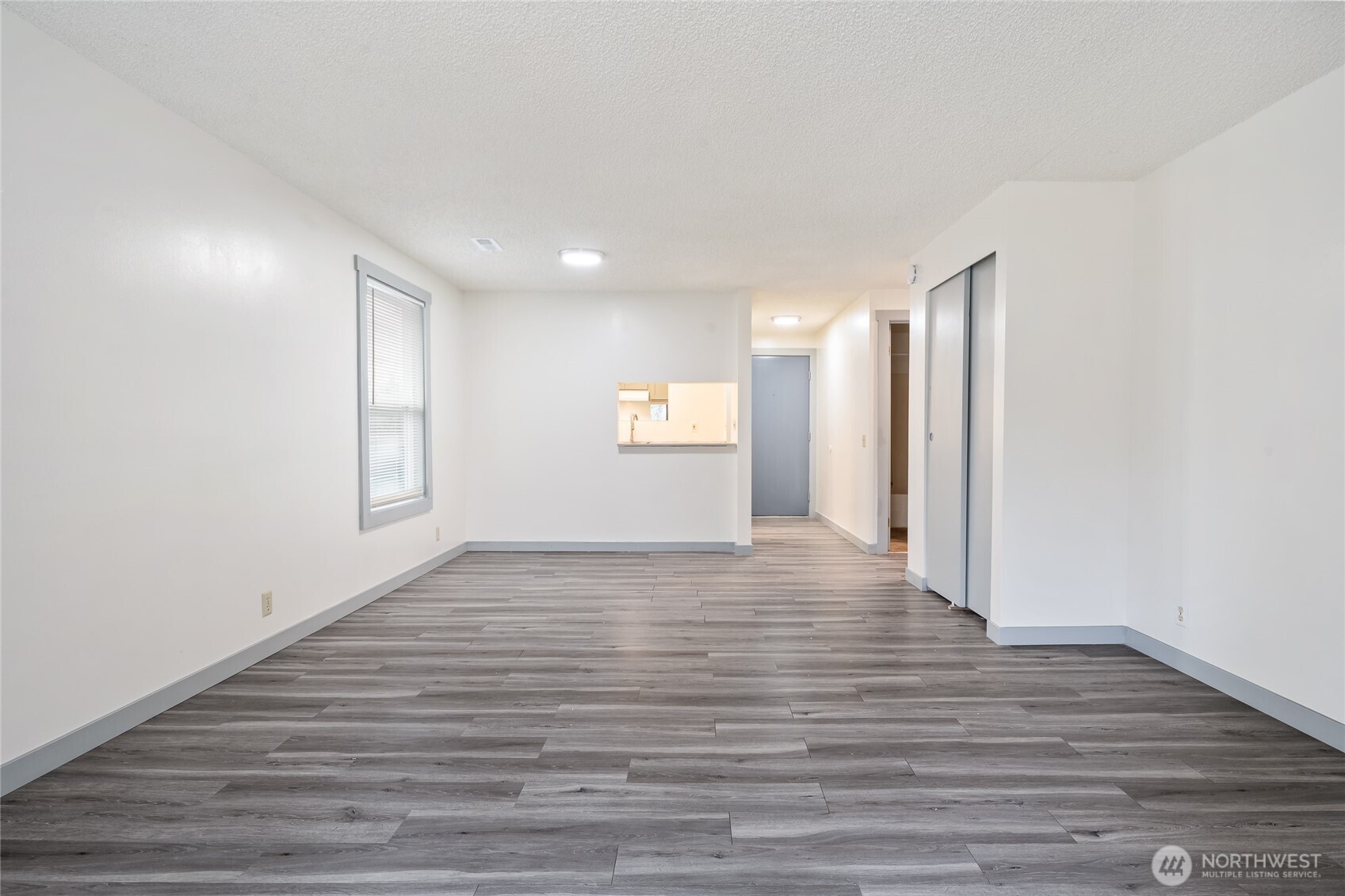 441-445 Smithers Avenue South Renton, WA 98057 - Photo 13 of 16 a view of an empty room and wooden floor