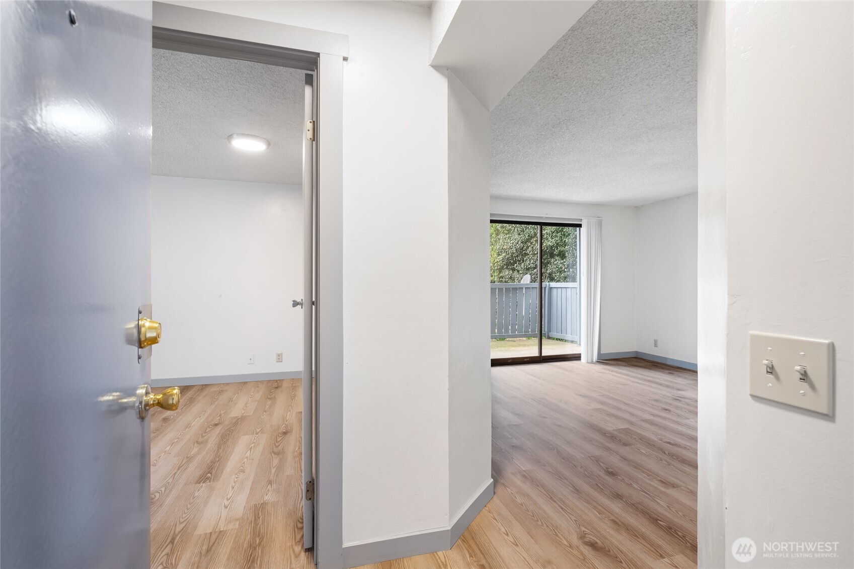 441-445 Smithers Avenue South Renton, WA 98057 - Photo 6 of 16 an empty room with wooden floor and windows