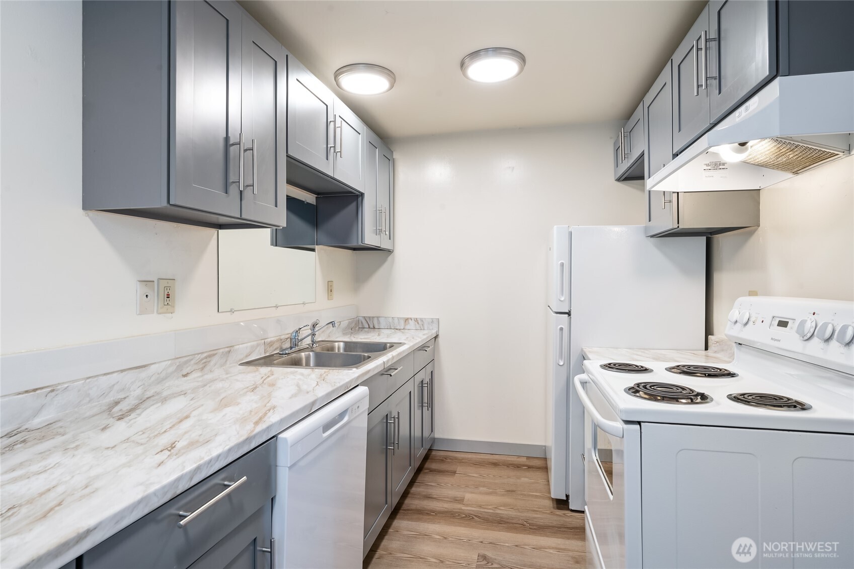 441-445 Smithers Avenue South Renton, WA 98057 - Photo 8 of 16 a kitchen with granite countertop stainless steel appliances a sink stove top oven and cabinets