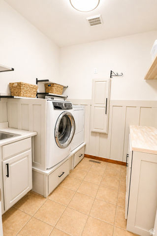 1055 North 1000 East Mapleton, UT 84664 - Photo 34 of 112 Dedicated laundry room featuring tile flooring, white shaker cabinetry, a utility sink, a butcher block style countertop, and board and batten wall detailing