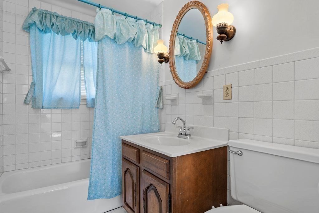 41 Durham Street Lawrence, MA 01843 - Photo 15 of 28 a bathroom with a sink and a mirror