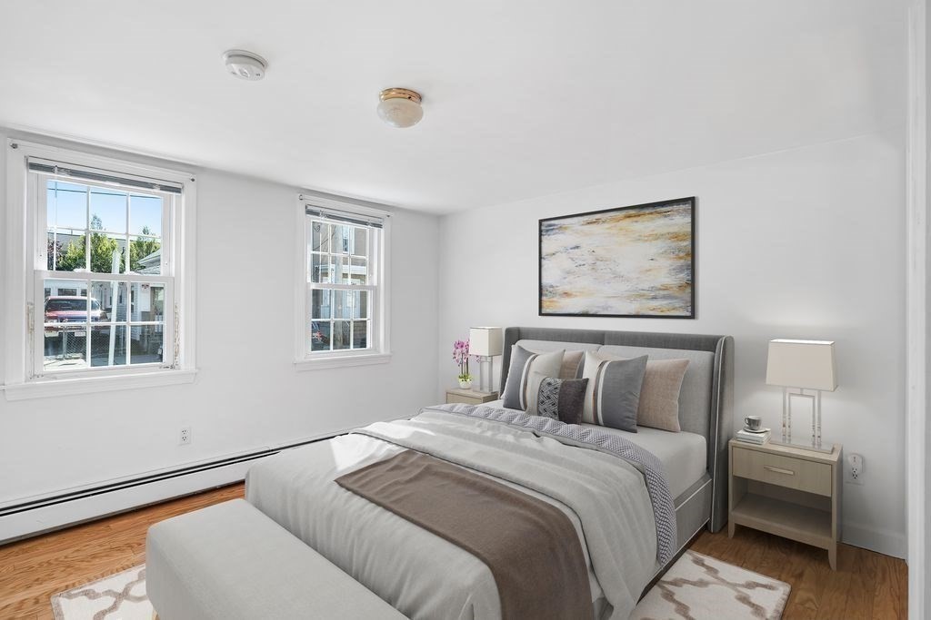 41 Durham Street Lawrence, MA 01843 - Photo 7 of 28 a bedroom with a bed and a painting on the wall