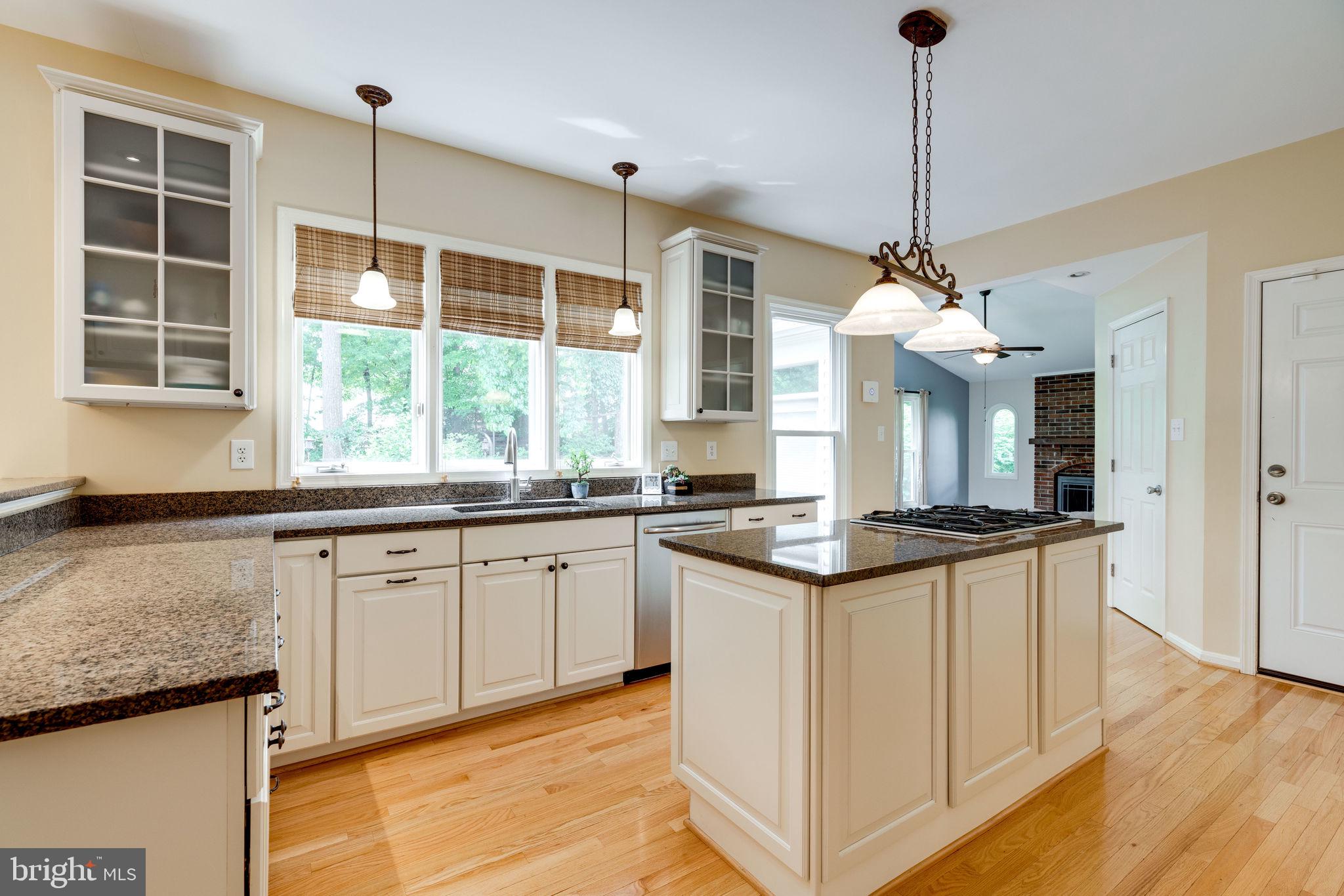 8959 Sycamore Ridge Road Fairfax Station, VA 22039 - Photo 24 of 63 Glass front cabinets, pendant lighting.