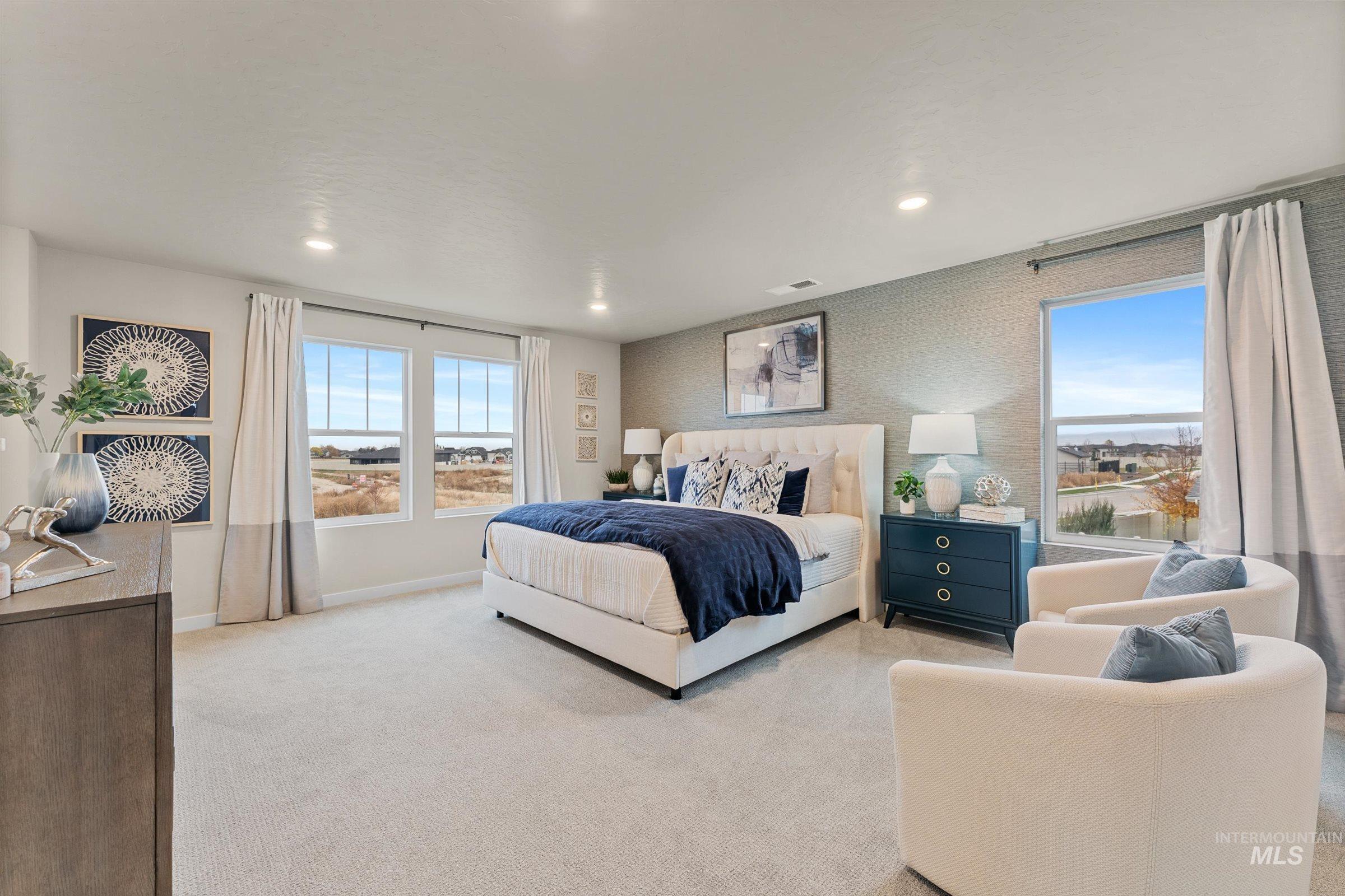 4149 South Colditz Way Meridian, ID 83642 - Photo 17 of 42 Bedroom with light carpet, multiple windows, wallpapered walls, and recessed lighting