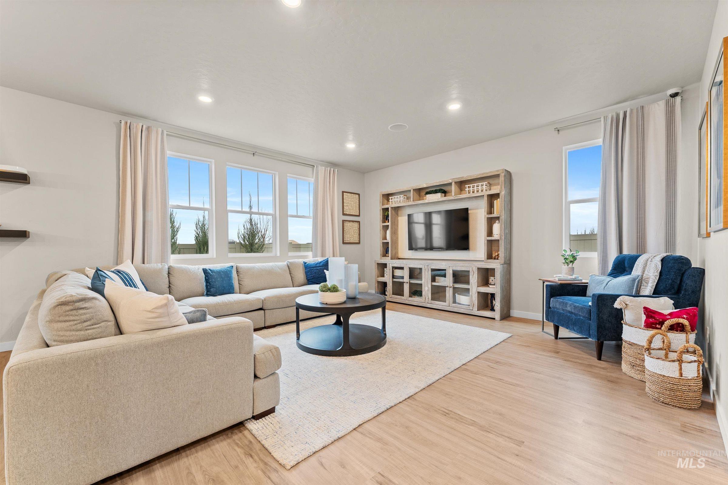 4149 South Colditz Way Meridian, ID 83642 - Photo 8 of 42 Living room with healthy amount of natural light, light wood-style flooring, and recessed lighting