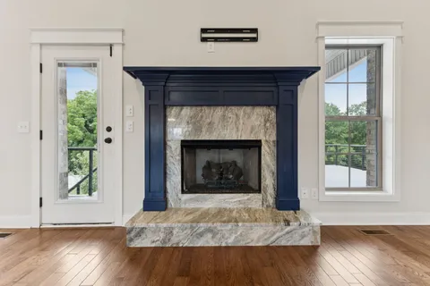 a kitchen with granite countertop a sink and cabinets