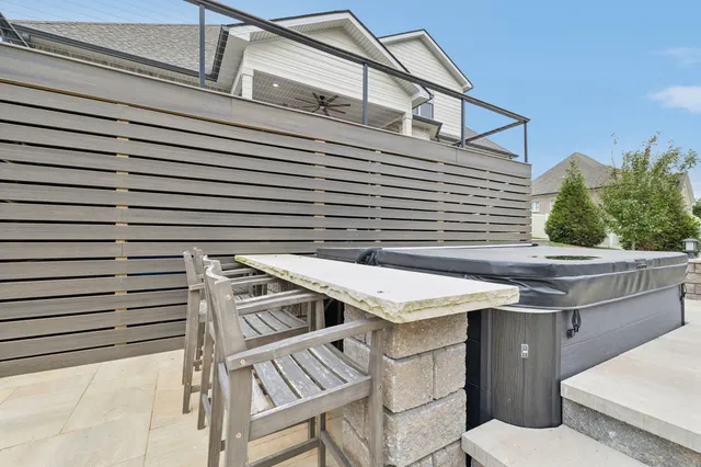 a bathroom with a granite countertop sink double and mirror