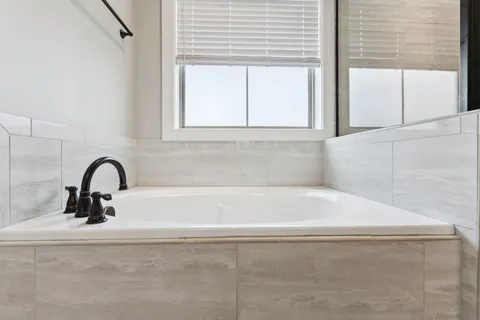a bathroom with a sink and cabinets