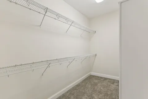 a view of a balcony with a yard