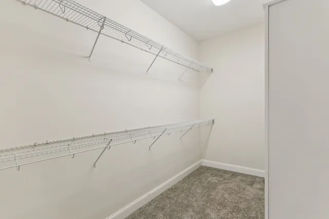 a view of a balcony with a yard