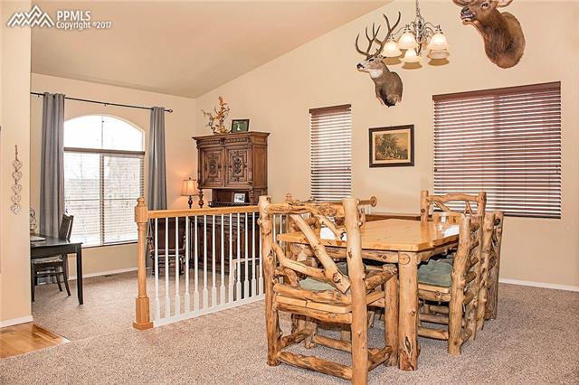 654 Struthers Ranch Road Colorado Springs, CO 80921 - Photo 5 of 35 Formal Dining and Living room off of entry way