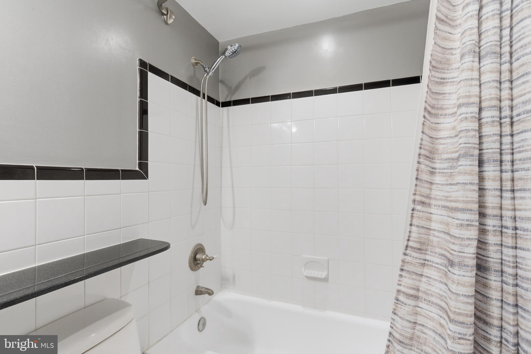 101 North Carolina Avenue Southeast, Unit G Washington, DC 20003 - Photo 14 of 17 a bathroom with a bathtub and a shower